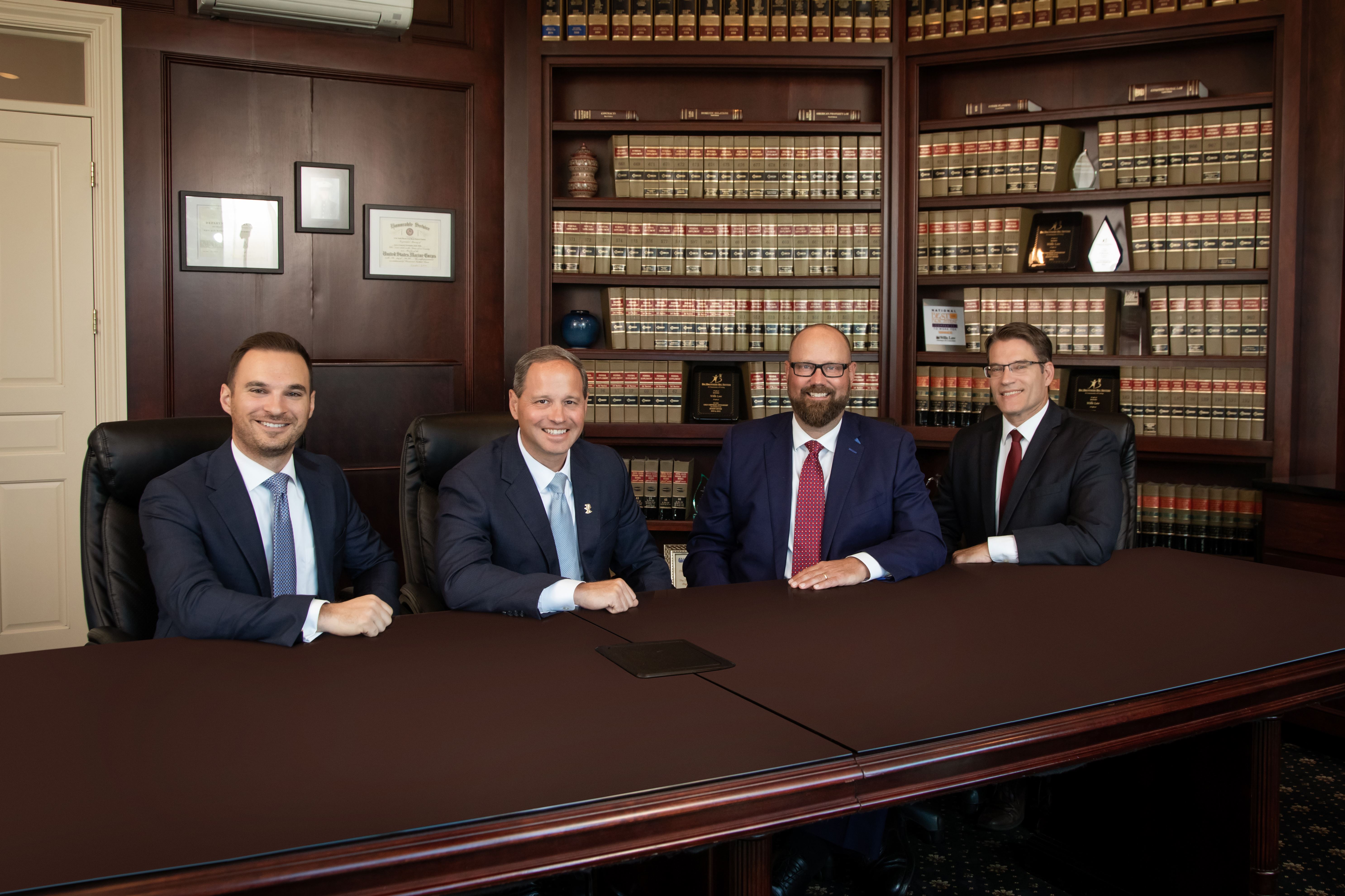 Lead Attorneys Sitting at conference table 